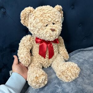 Cuddly Tan Teddy Bear with Red Ribbon